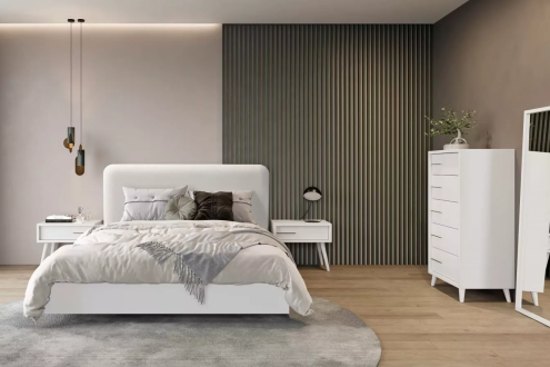 Couple's bedroom with a fabric headboard and white lacquered furniture